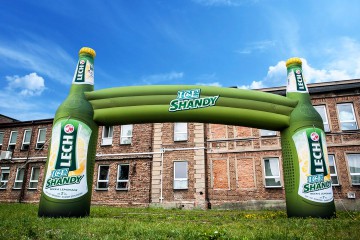 Advertising gate with Lech Ice Shandy bottles.
