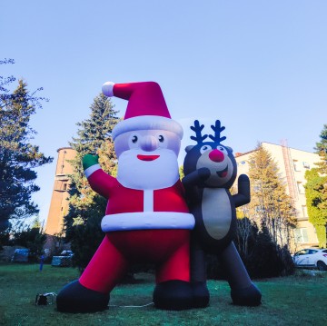 Santa Claus with a Reindeer - the perfect complement to the city's Christmas scenery.