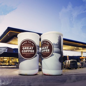 Unusual advertising balloons in the shape of a coffee cup